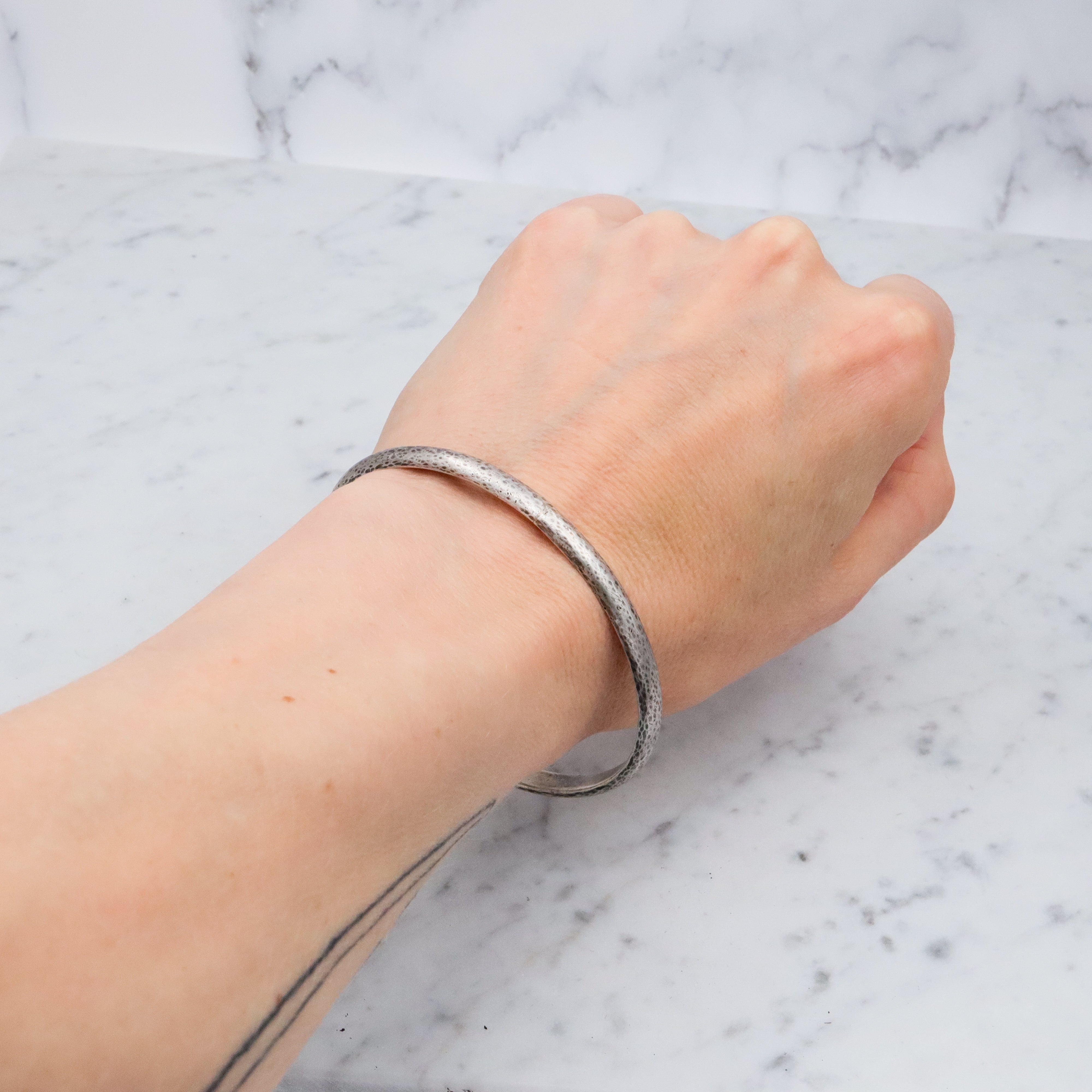 Mid Century hand hammered solid sterling oval bangle